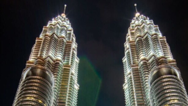 The Petronas Towers illuminated at night. - Vivo by Plush (Kuala Lumpur)