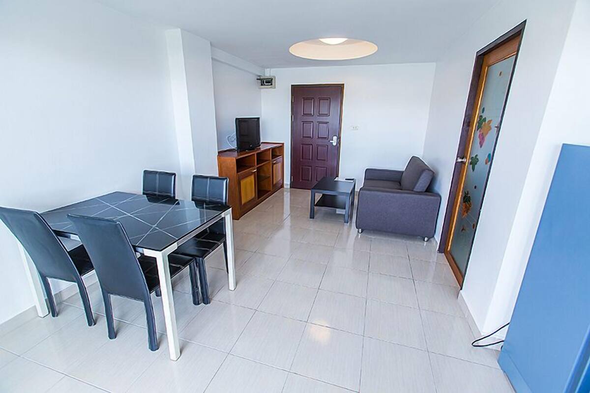 1-Bedroom Condo | Living area | Flat-screen TV