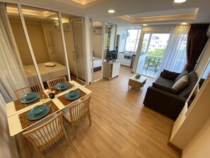 2-Bedroom Condo | Living room | Flat-screen TV - Ruamchok Condos (RC5) (Pattaya)