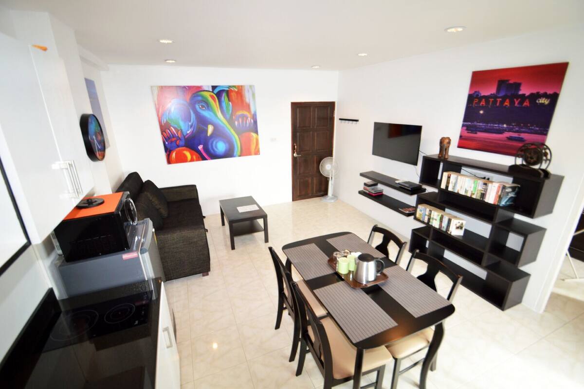 1-Bedroom Condo | Living area | Flat-screen TV