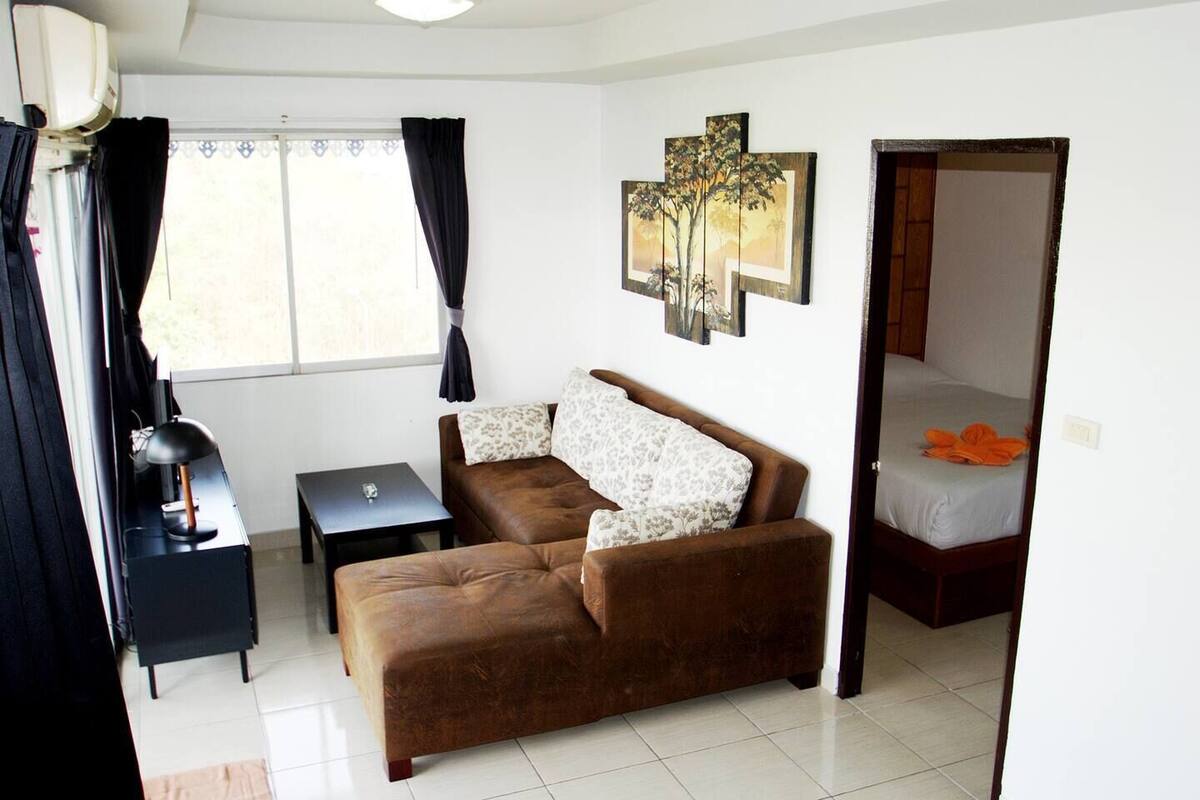 1-Bedroom Condo | Living area | Flat-screen TV