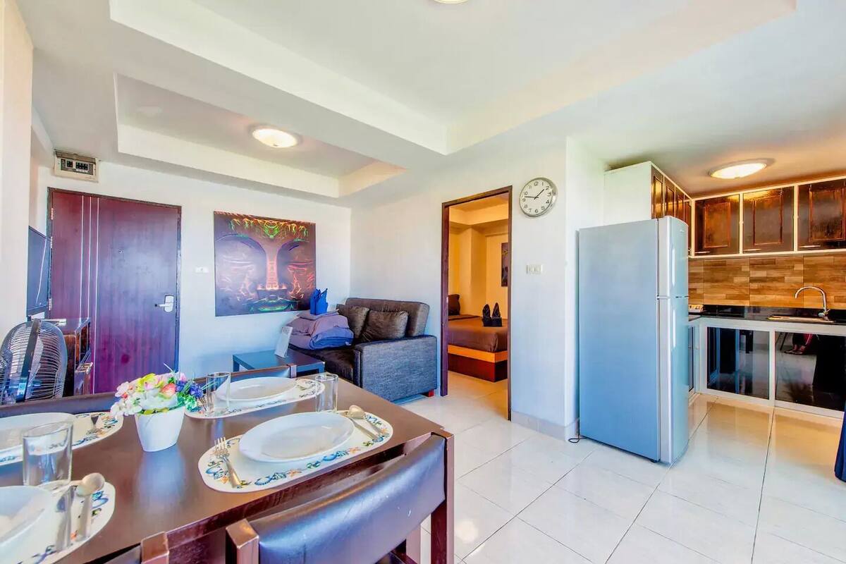 1-Bedroom Condo | Living area | Flat-screen TV
