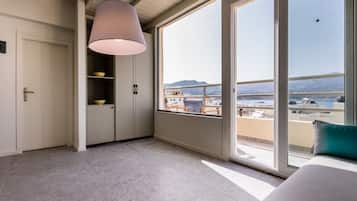 Penthouse, Balcony, Harbor View | Living area | 42-inch flat-screen TV with satellite channels