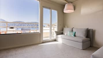 Penthouse, Balcony, Harbour View | Living area | 42-inch flat-screen TV with satellite channels