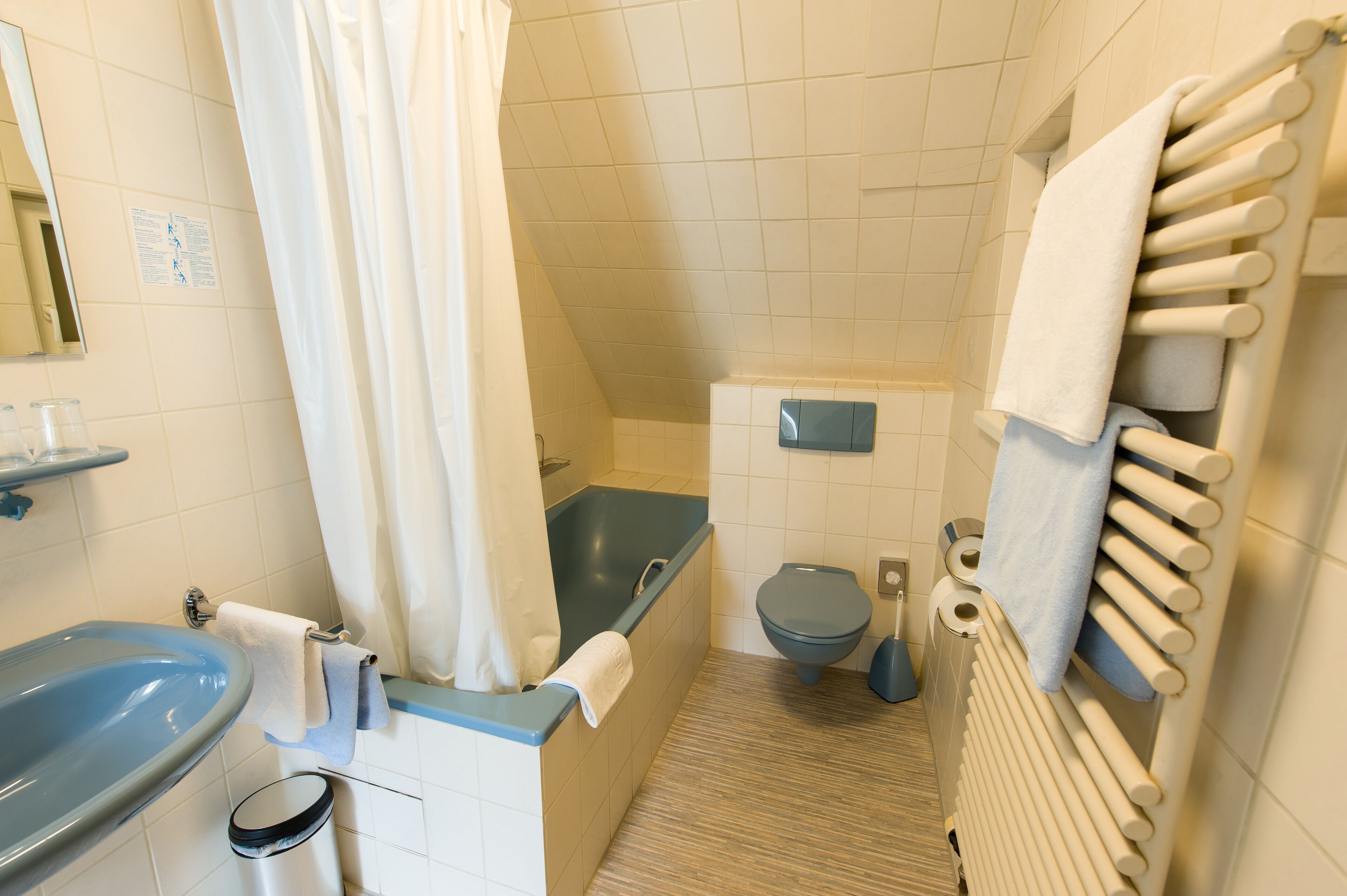 basic twin room | bathroom | shower, hair dryer, towels, soap