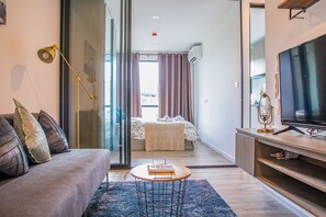 Comfort Apartment, 1 Bedroom | Living area | LED TV - Apartment 450m from BTS with Sky Pool - bkbloft8 (Samut Prakan)