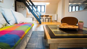 Apartment (2 Bedrooms) | Living room | 40-inch TV with cable channels - Charming Triplex Near Avenue Louise (Brussels)