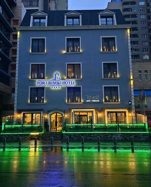 A hotel with a sign reading "Port Rivoli Hotel Baku" and a visible entrance. - Port Rivoli Baku Hotel (Baku)
