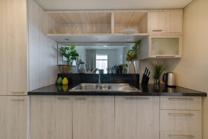 Deluxe Apartment, 2 Bedrooms | Private kitchen | Fridge, microwave, oven, stovetop - Maison Privee - Central Dubai Apt w/Danish Twist & Burj Khalifa Vws (Dubai)