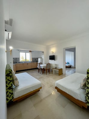Appartement Confort, 2 chambres | Aire de séjour | Téléviseur à écran plat