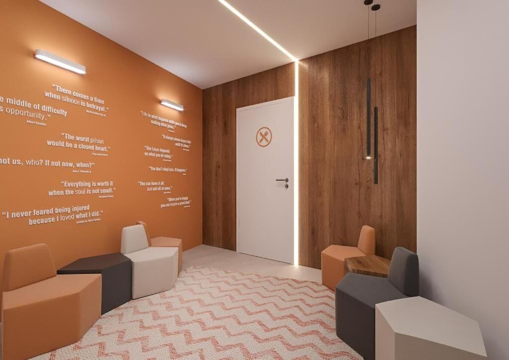 A modern waiting area with a wooden wall, a white door, and several seating options.