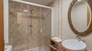 Bathtub, hair dryer, towels, soap