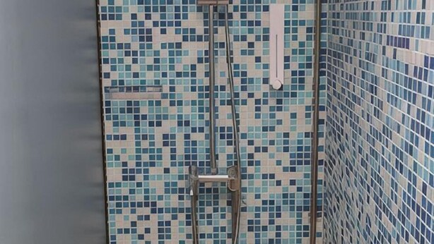 A tiled wall with a geometric pattern. - The Bohemian (Singapore)