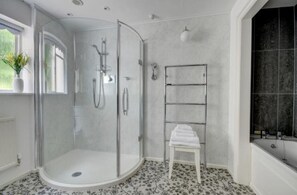 Bathtub, hair dryer, towels, soap
