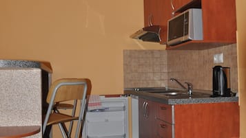 Mini-fridge, microwave, stovetop, high chair