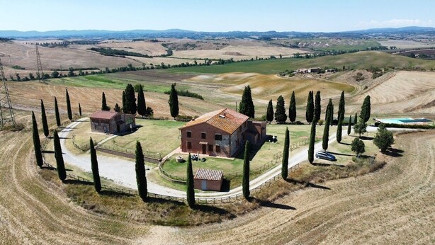 A rural property with a large house surrounded by a fence, a small barn, and a swimming pool. - STAFFOLINO Apartment 1                                        (siena)