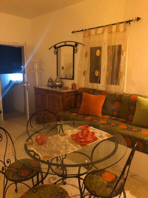 Luxury Studio, 1 Bedroom | Living area | Flat-screen TV