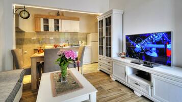 Classic Apartment | Living area | 39-inch TV with cable channels