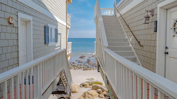 A pathway leading to a beach with a staircase and a railing. - Oceanfront on Dry Sandy Carbon Beach - Sandpiper (Malibu)