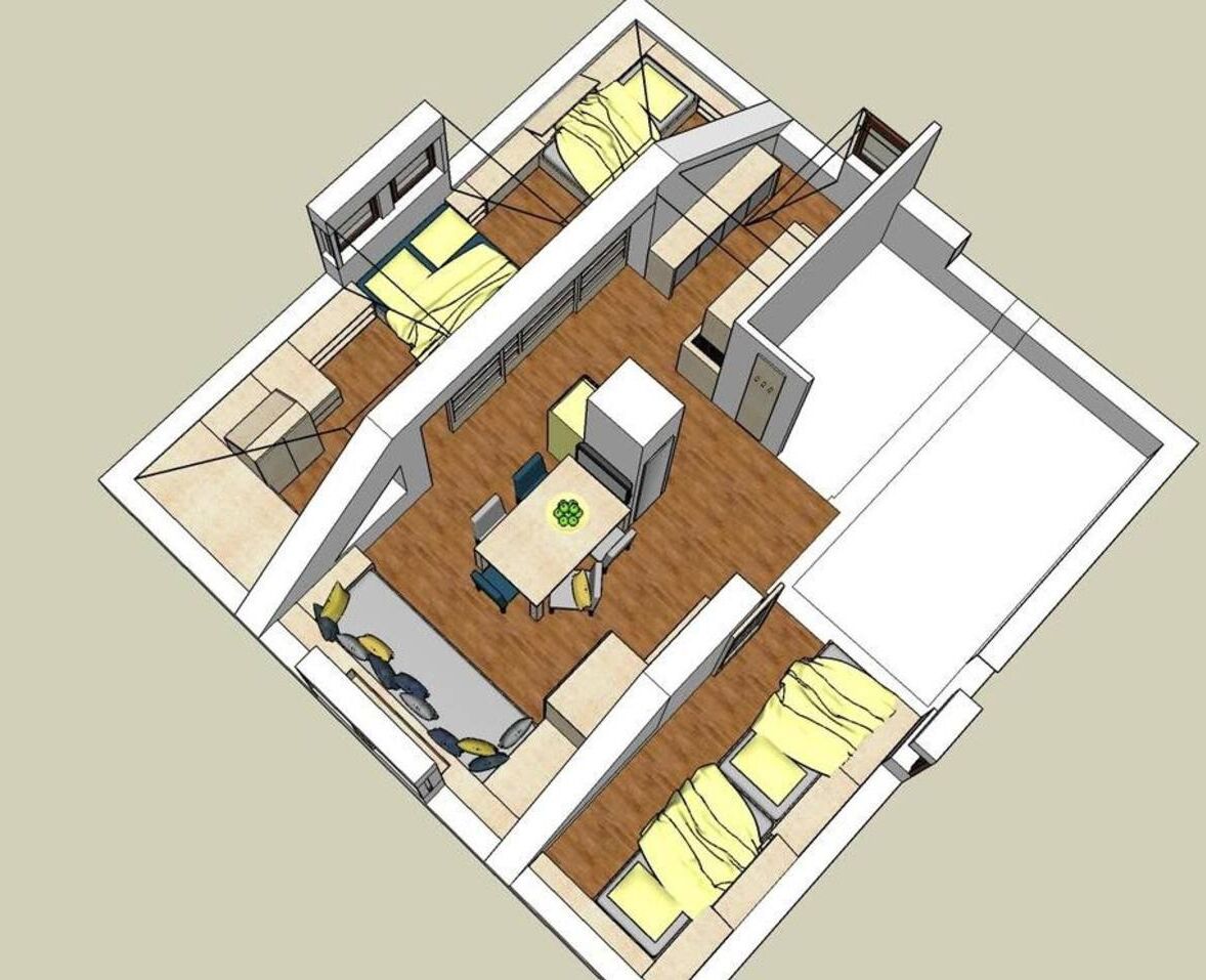 Een 3D plattegrond van een hotelkamer, met een bed, een bureau, een stoel en een kleine zithoek.