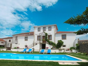 A two-story white building with a swimming pool and blue lounge chairs in front. - Beautiful private villa for 10 people with private pool, WIFI, A/C, TV and terrace (Prestar)