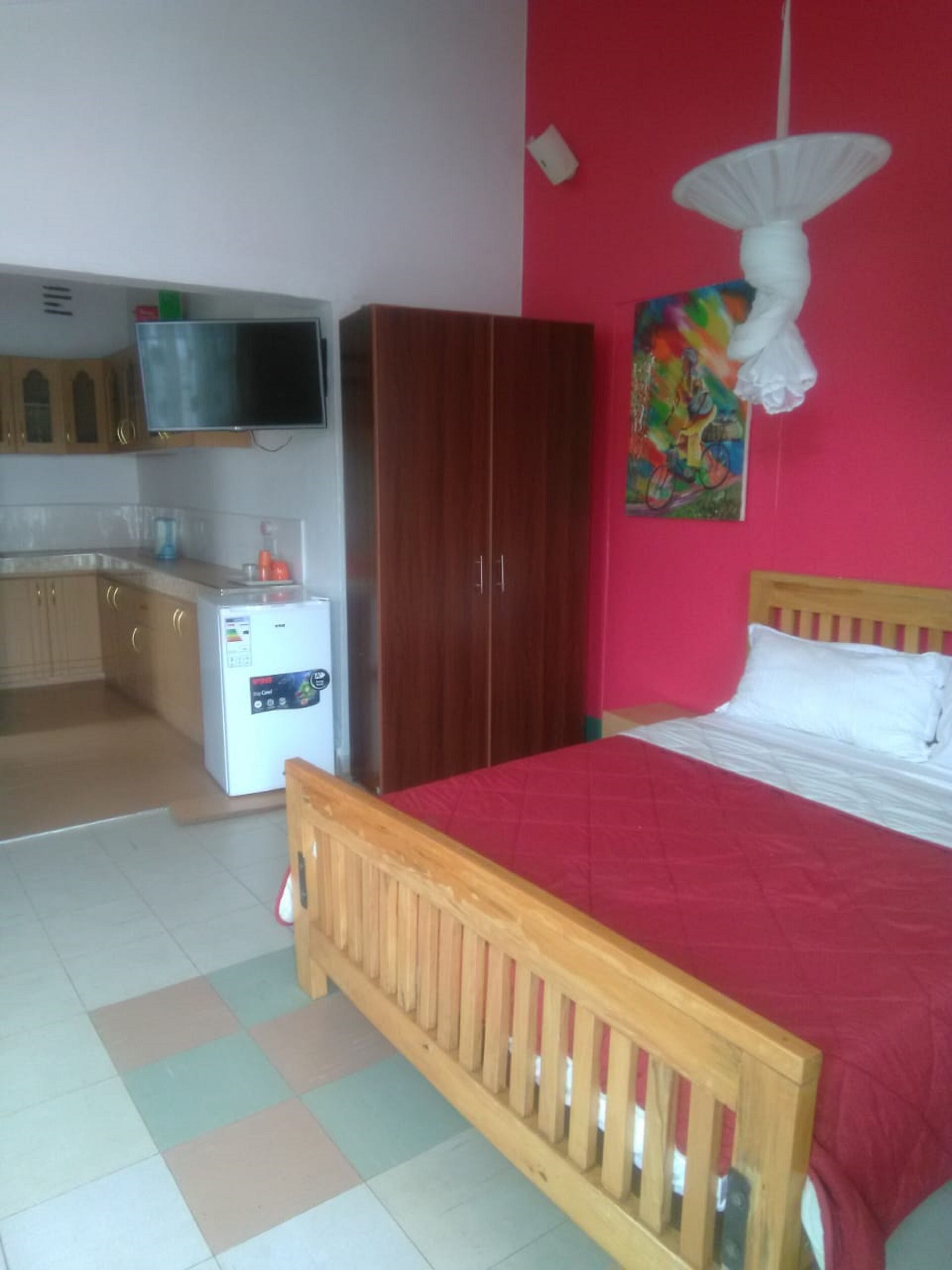 Desk, blackout drapes, iron/ironing board, bed sheets