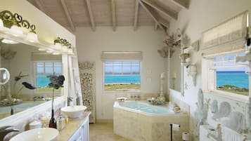 Bathtub, eco-friendly toiletries, hair dryer, towels