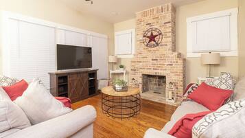 Smart TV, fireplace, books