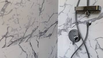 Shower, eco-friendly toiletries, hair dryer, bidet