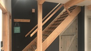 A wooden staircase with a dark wall and a door. - The Stag Chalet,  new Sauna in the forest! Fast wifi! (Golden)