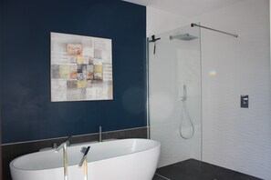 Bathtub, hair dryer, towels, soap