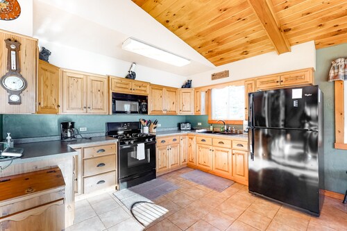 Spacious lakefront home with pier views, canoe, and fire pit - family-friendly