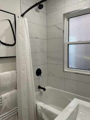 City House | Bathroom | Free toiletries, hair dryer, bathrobes, slippers - Legacy Suites (Sudbury)