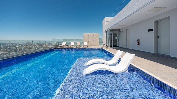 Outdoor pool, open 7:00 AM to 11:00 PM, sun loungers