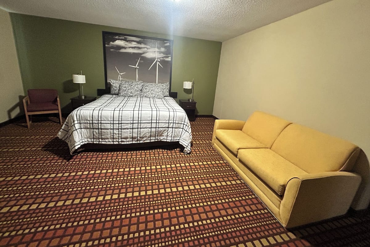 Suite, 1 trĂšs grand lit, non-fumeurs | Bureau, fer et planche Ă repasser, Wi-Fi gratuit, draps fournis