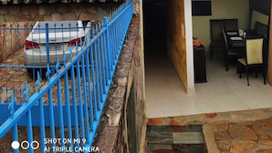 A multi-level building with blue railings and a staircase. - Diamond Hostel (Ouro Preto)