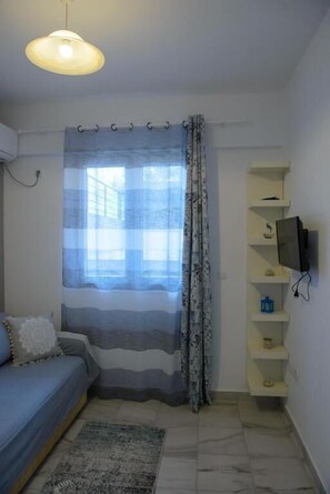 Family Apartment, 2 Bedrooms | Living area | Flat-screen TV - Artemissoula (Spata-Artemida)