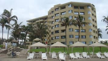 Private beach, white sand, sun loungers, beach umbrellas