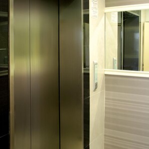 An elevator interior with metallic walls and a reflective surface. - Old Penang Hotel - Penang Times Square (George Town)
