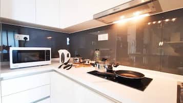 Fridge, microwave, cookware/dishes/utensils