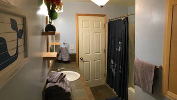 Combined shower/tub, hair dryer, towels, soap