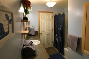 Combined shower/tub, hair dryer, towels, soap