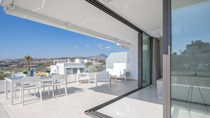 A modern balcony with a clear view of the cityscape and mountains. - Marbella Golf With Pool Cataleya, Marbella, Spain (Marbella)