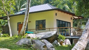 A two-story building with a flat roof, large windows, and a balcony. - Domaine Desaubin Luxury Villas (Mahé Island)