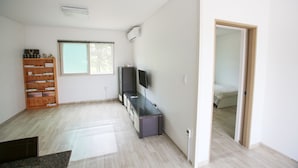Room, Multiple Beds (104) | Living area | Flat-screen TV, heated floors - Seorabeol Pension (Nonsan)