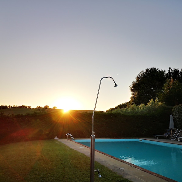 Seasonal outdoor pool, open 7:00 AM to 8:00 PM, pool loungers