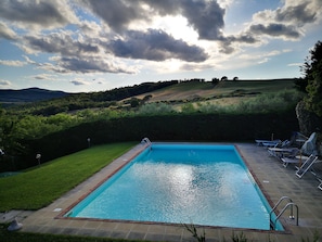 Seasonal outdoor pool, open 7:00 AM to 8:00 PM, pool loungers