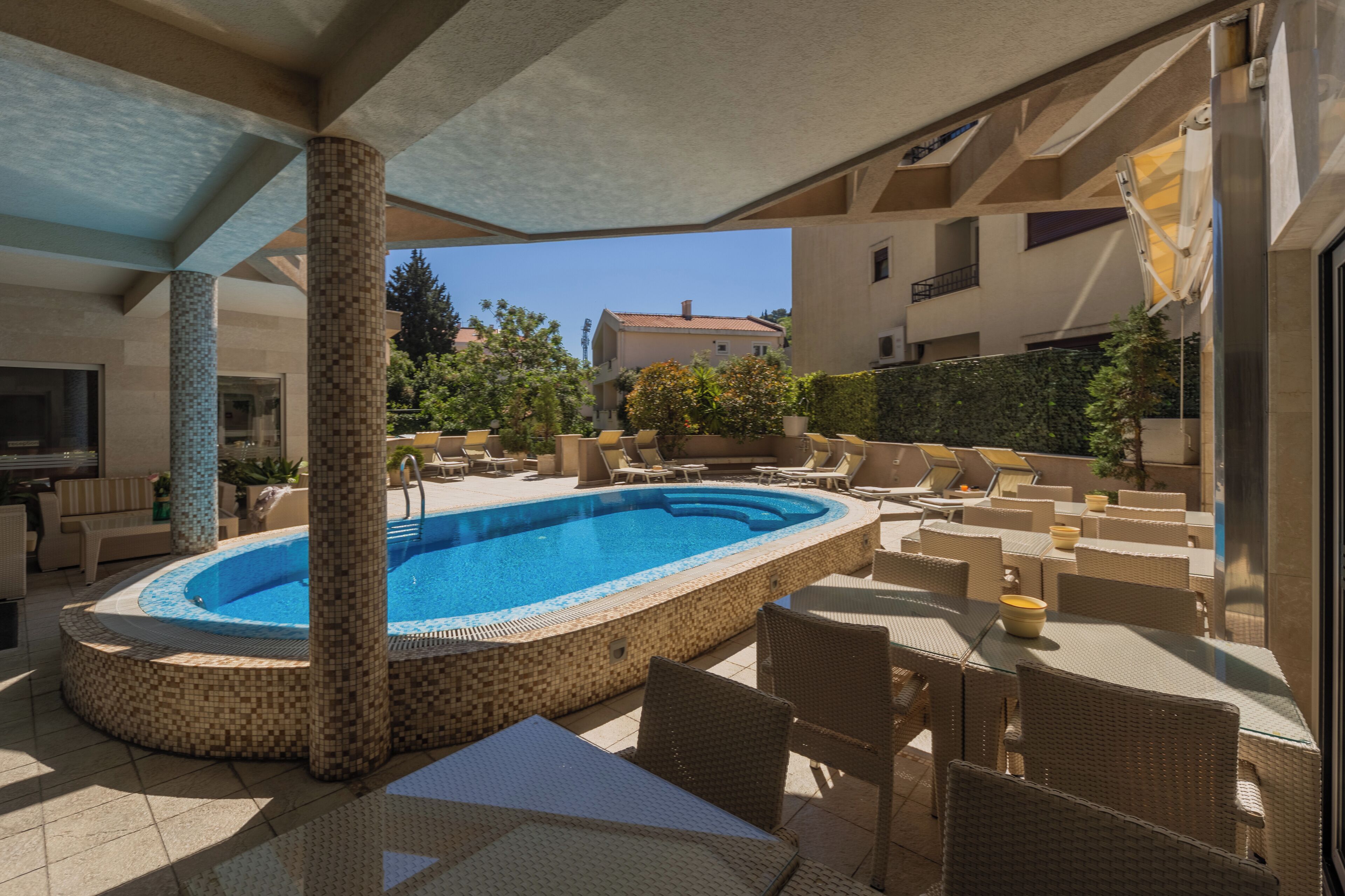 Seasonal outdoor pool, open 11:00 AM to 9:00 PM, pool loungers