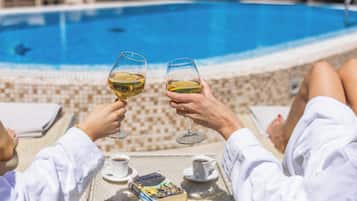 Seasonal outdoor pool, open 11:00 AM to 9:00 PM, pool loungers