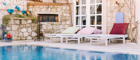Seasonal outdoor pool, open 10:30 AM to 7:00 PM, sun loungers